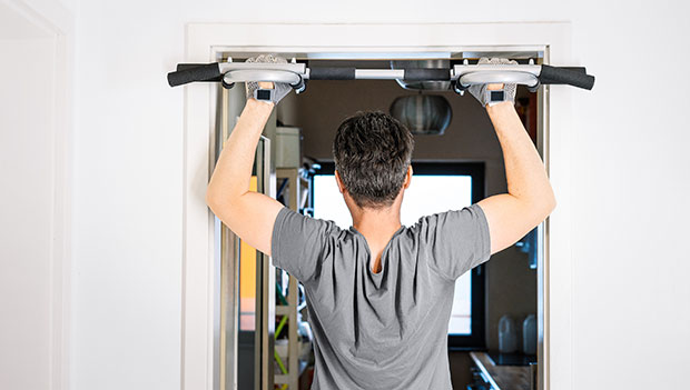 man-using-a-pull-up-bar