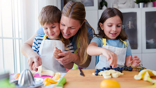 mother and children preparing snacks